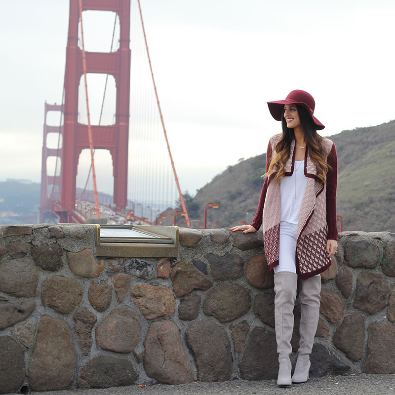 Burgundy sweater and floppy hat and over the knee boots