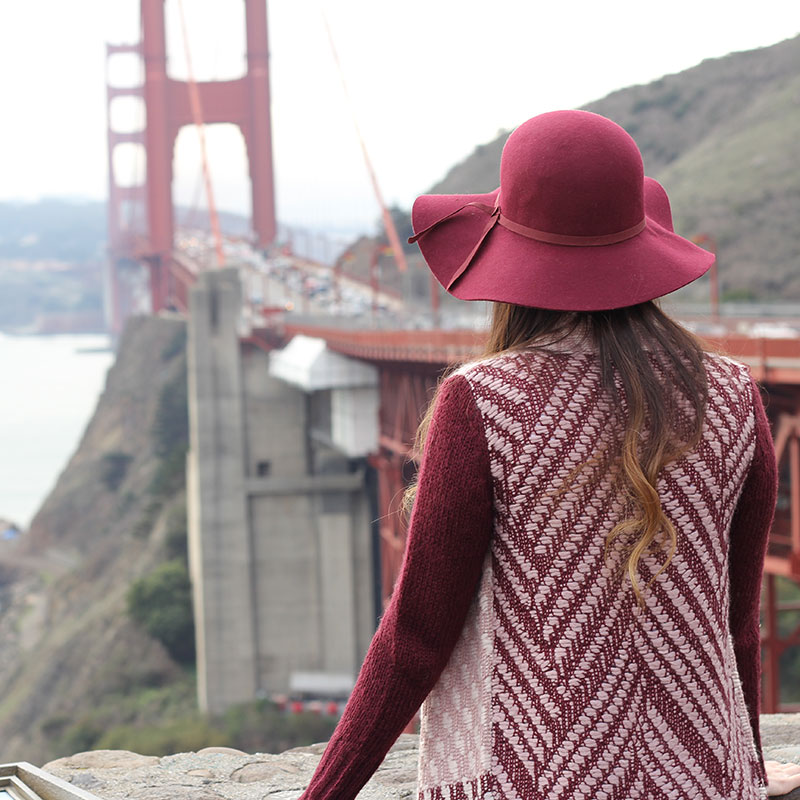 Burgundy sweater and floppy hat