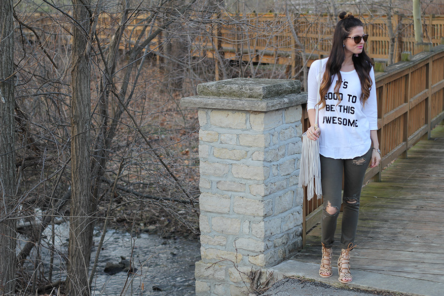 Distressed green jeans and leopard wedges and graphic top
